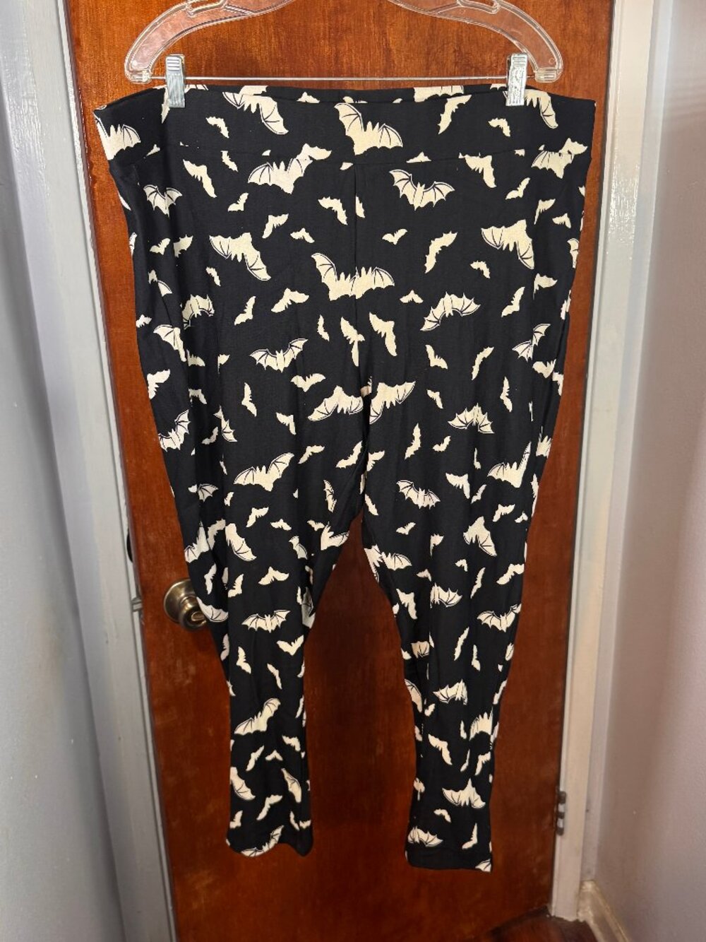 Torrid Platinum Fleece-Lined Bat Print leggings.
